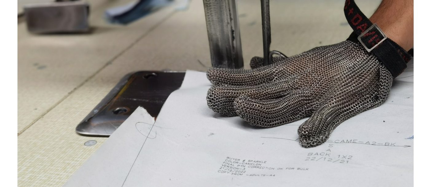 A tech pack and cut-resistant glove during in-process quality checks